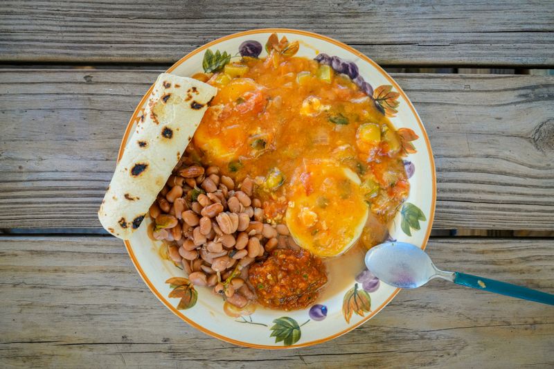 Smothered breakfast burrito with eggs and chorizo