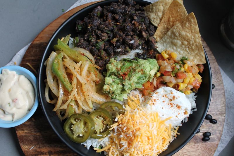 Tex-Mex rice bowl with grilled protein and toppings
