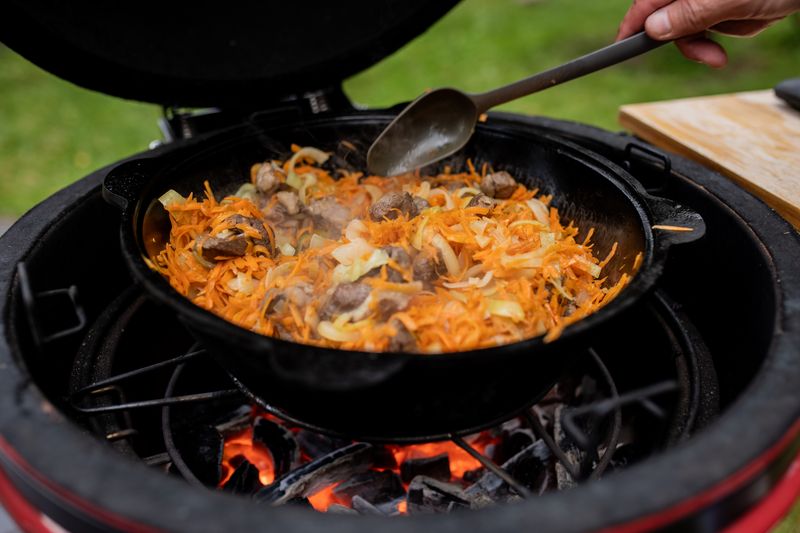Fajita plate with sizzling peppers and tortillas